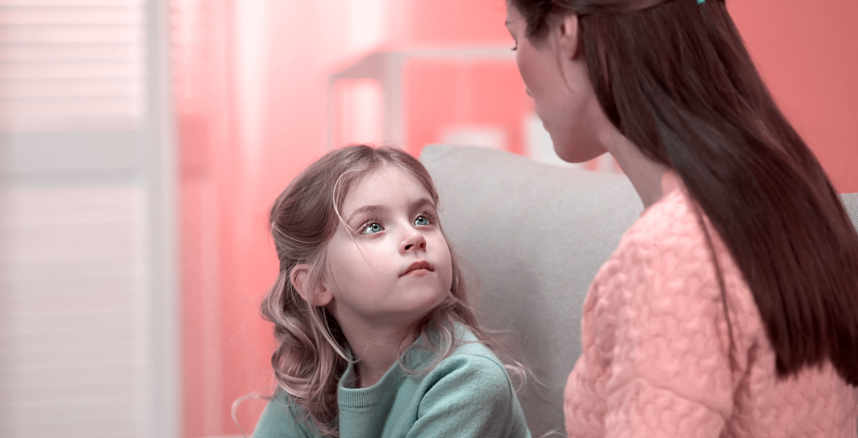 Mother and young daughter in positive discussion