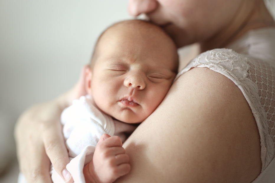 Mother holding newborn baby